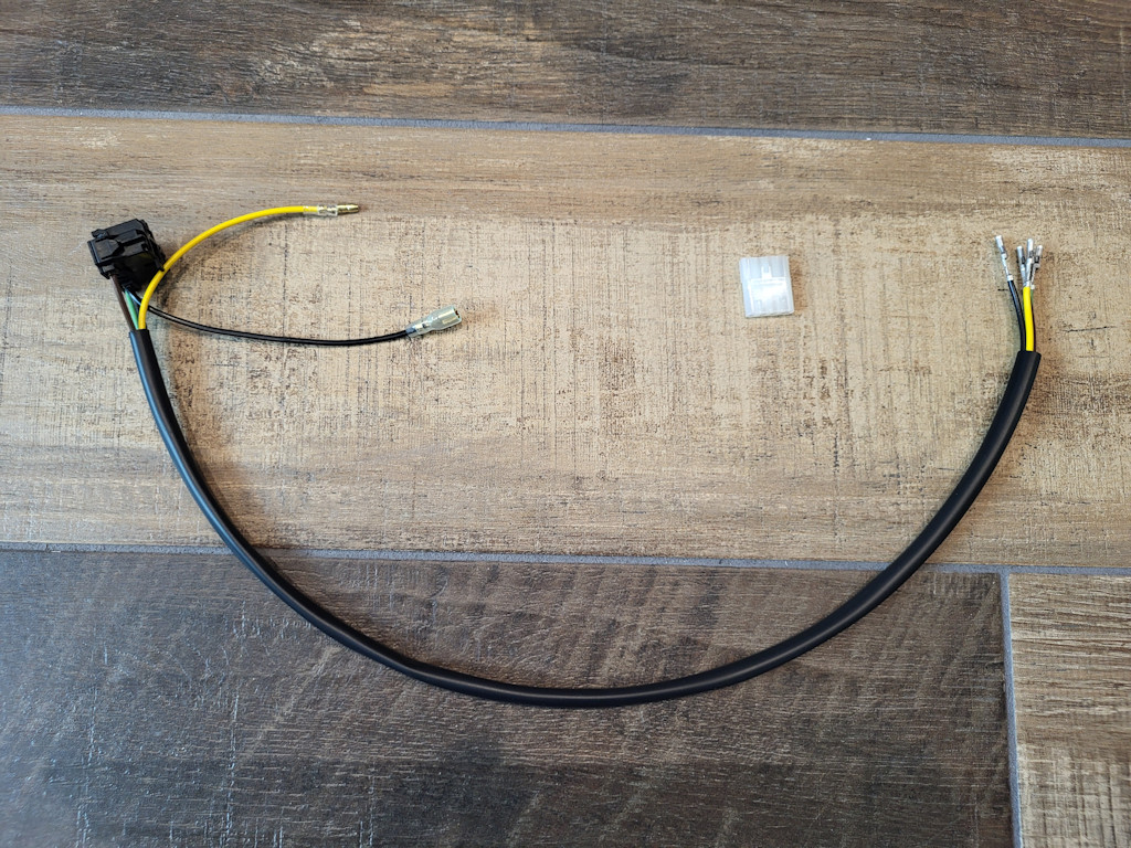 Dash harness to headlight bulb (fits through single hole in the rear of the headlight bucket). Applicable to the Moto Guzzi V35 III, V50 III.