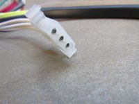 3 terminal connection that fits into the headlight shell.